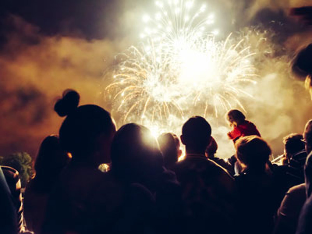 Group of people watching fireworks