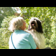 A woman embracing her happy dog