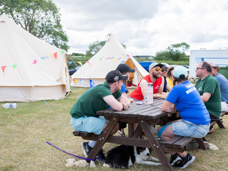 Group photo of YKC members sat at picnic tables